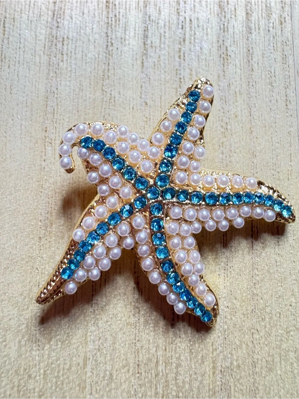 Gold Starfish Brooch with Blue Crystal Accents and Pearl Detail
